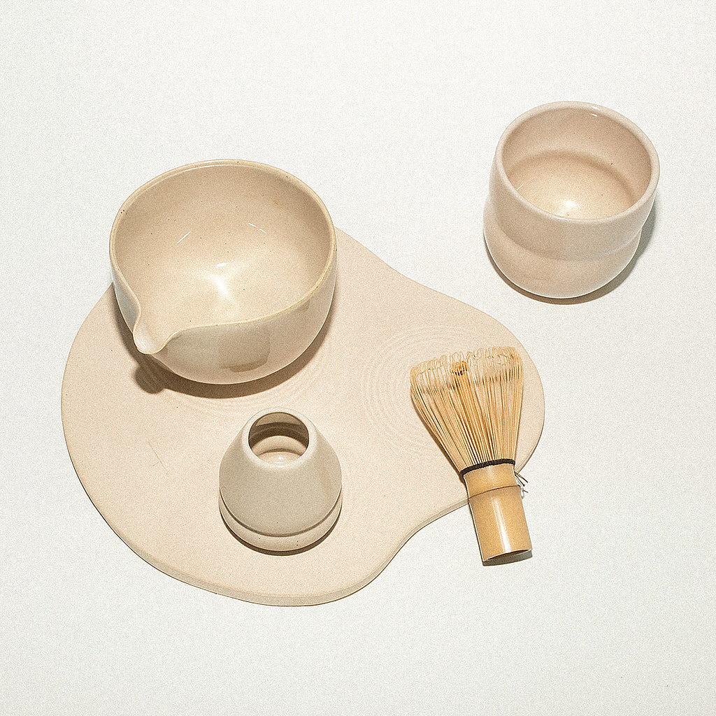 Cream- toned matcha set including a whisk, bowl, whisk holder